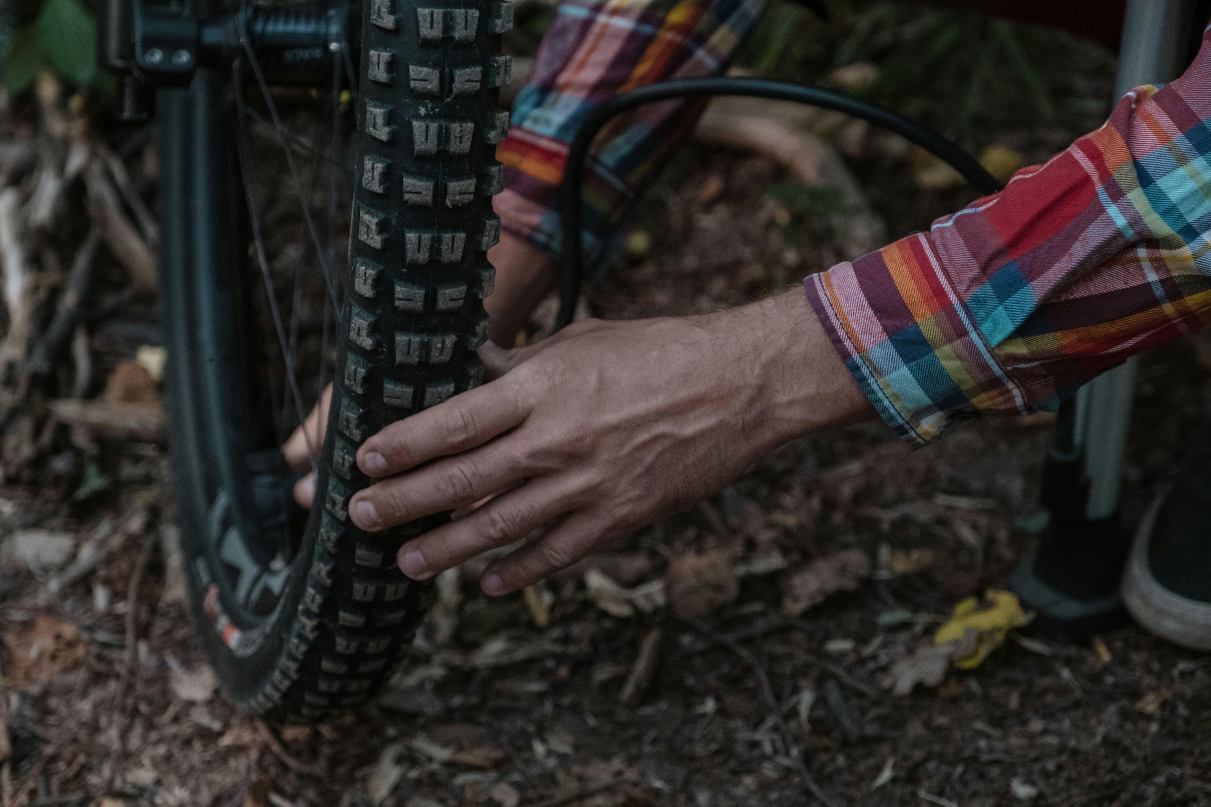 Man inflating a mountain bike tire