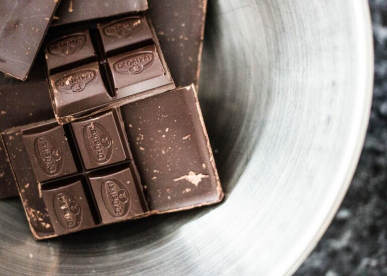 Chocolate bars broken up in mug as supplements for athletes