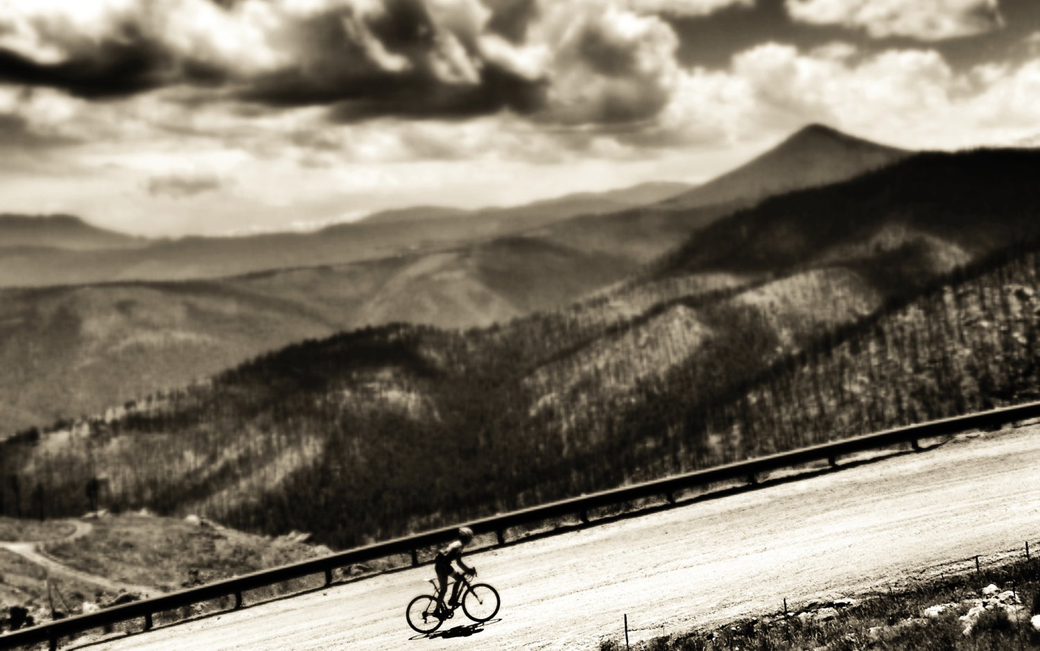 black and white image of lonely rider at a high altitude
