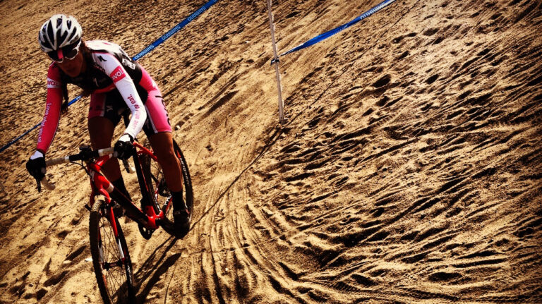 Racing cyclocross through the sand for training