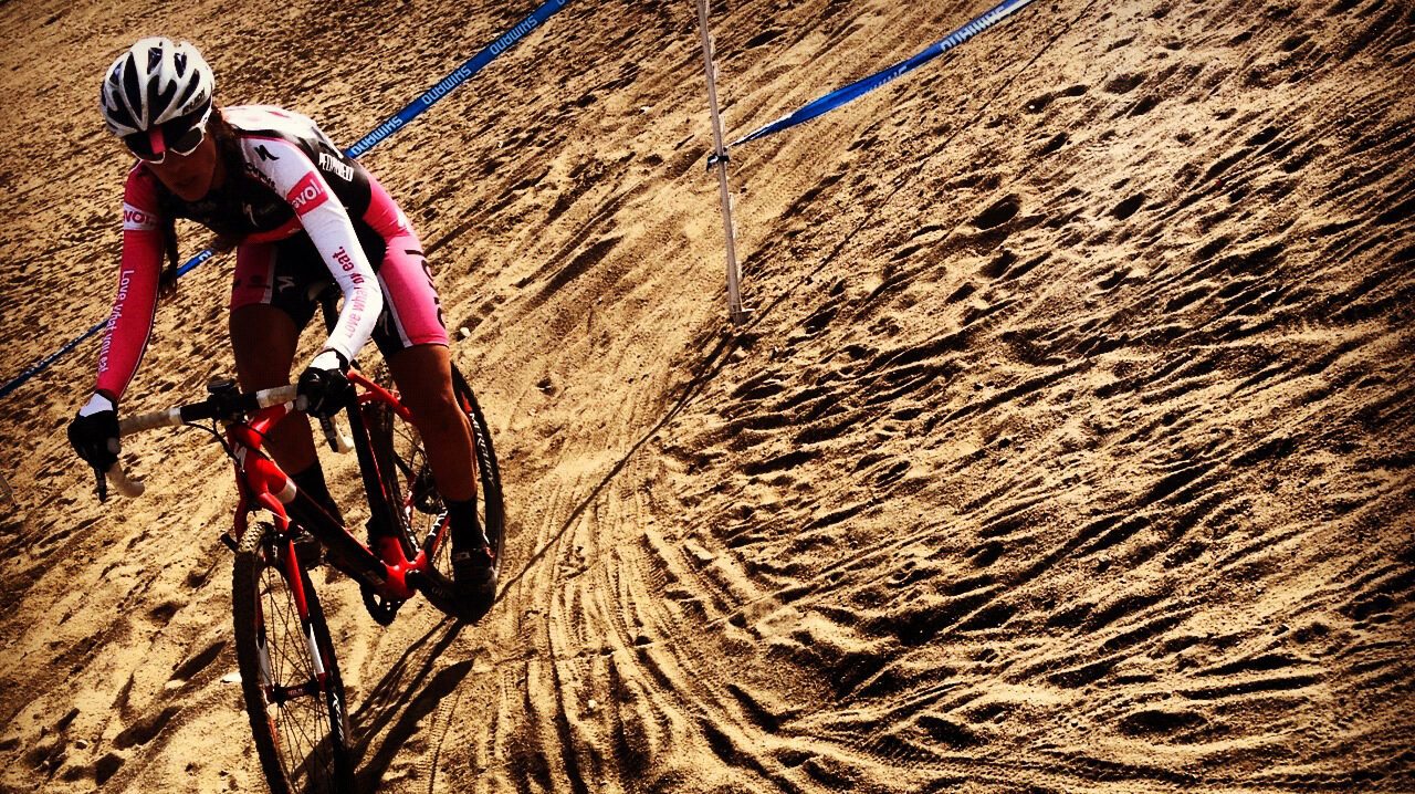 Racing cyclocross through the sand for training
