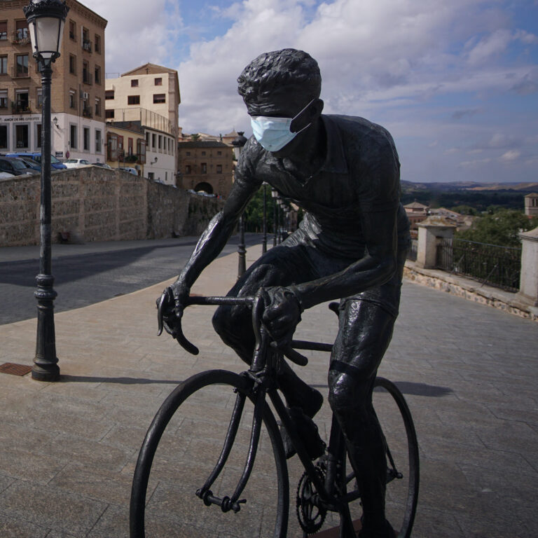 Adjusting Training During COVID-19 with Dr. Stephen Seiler, biker statue with mask on