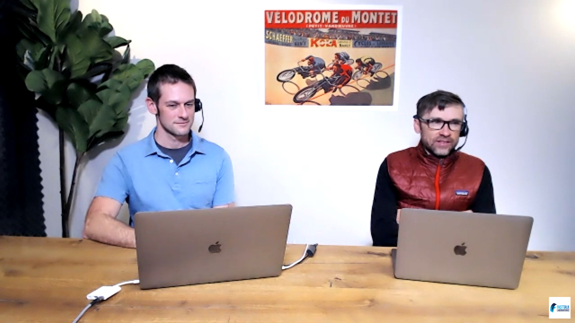 Ryan Kohler and Chris Case sit together at a table.