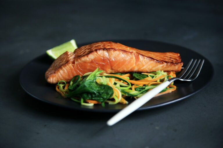 Filet of Salmon on Plate with Salad, Lime and Fork