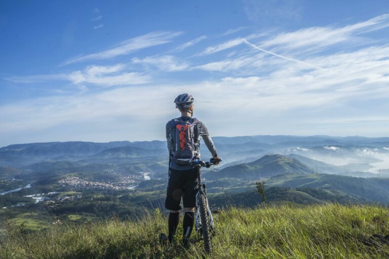 cyclist overlooking the mountains