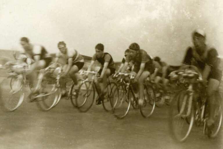 sepia toned photo of a team of cyclists