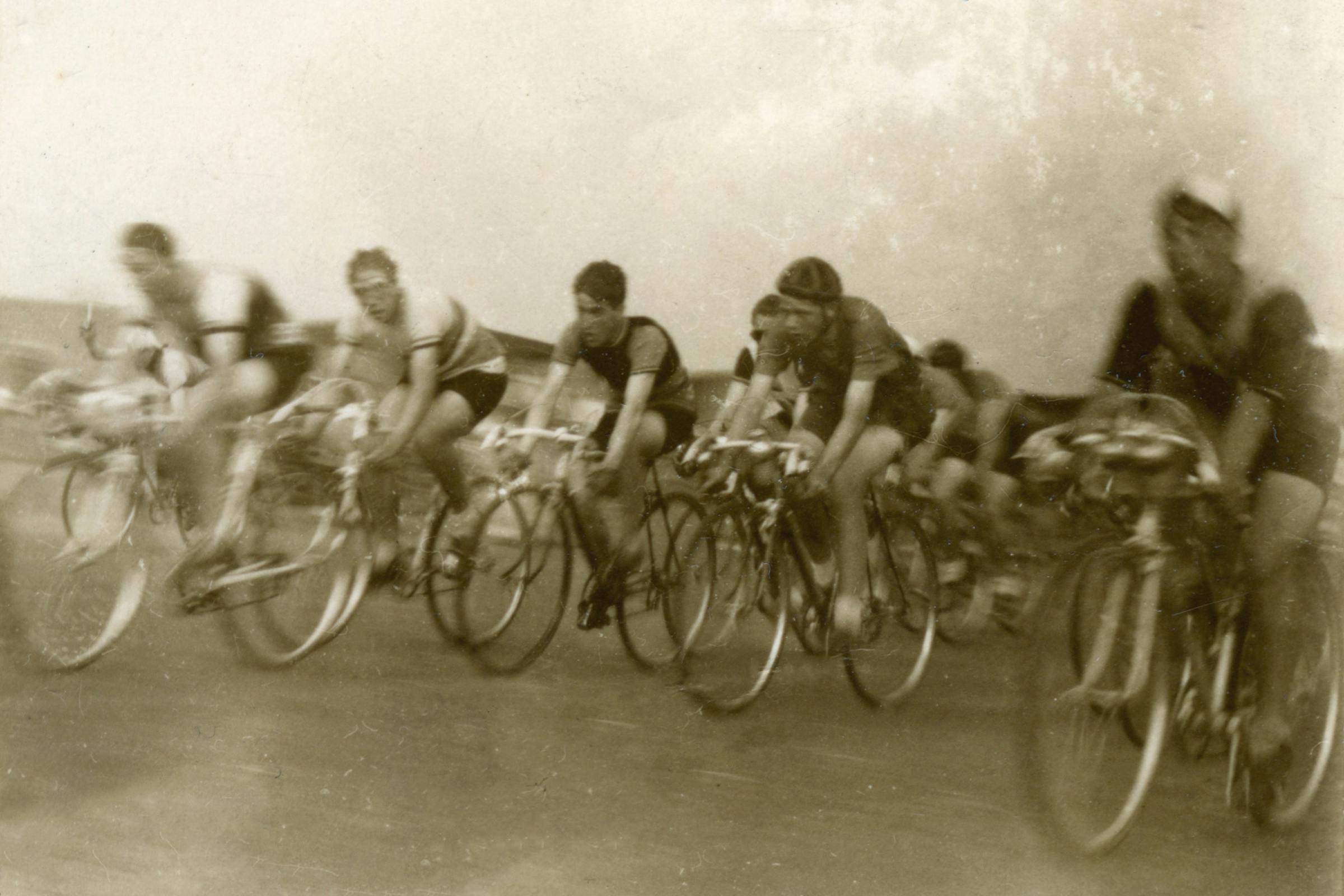 sepia toned photo of a team of cyclists