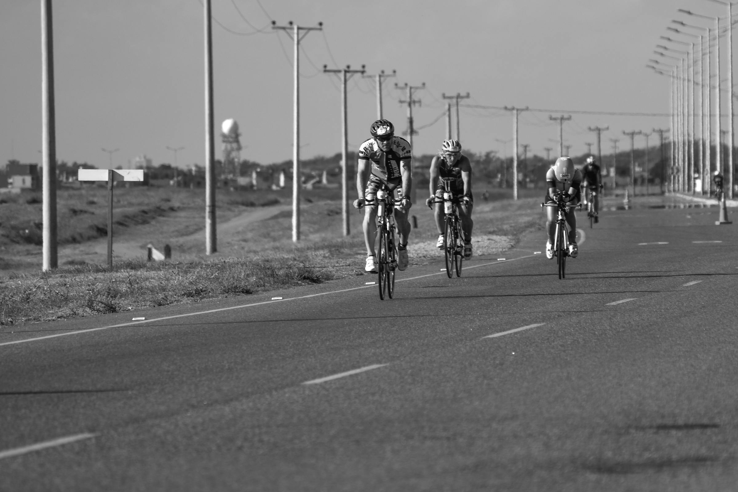 cyclists on a long road