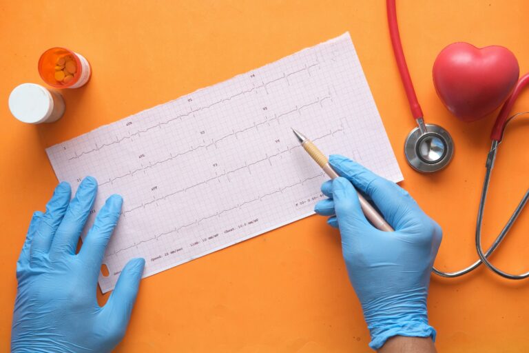 doctor indicating on a heart rate chart