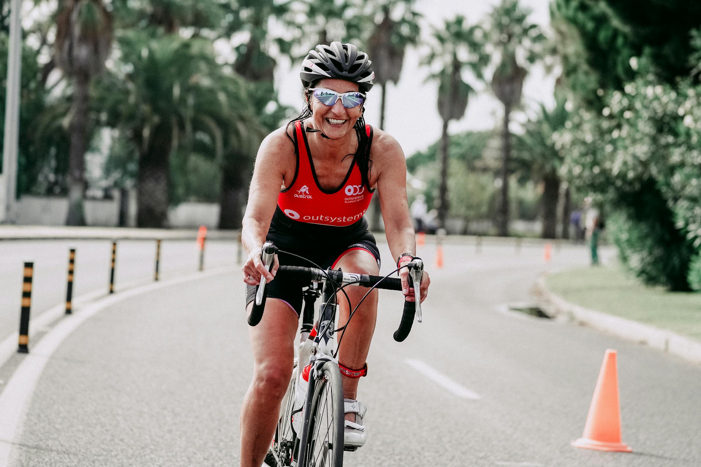 female cyclist smiling in a race