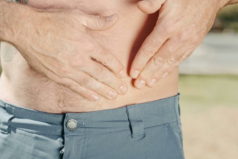 male holding his stomach