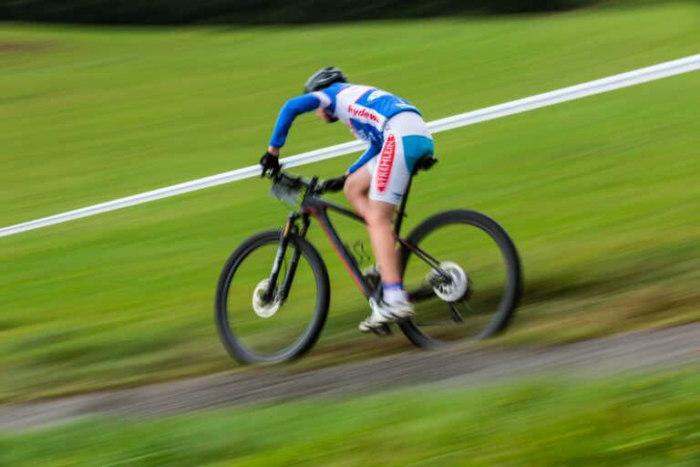cyclist speeding down a hill