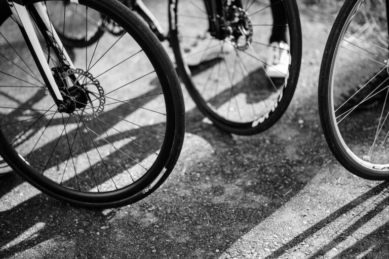 Black and white still of upright bike wheels