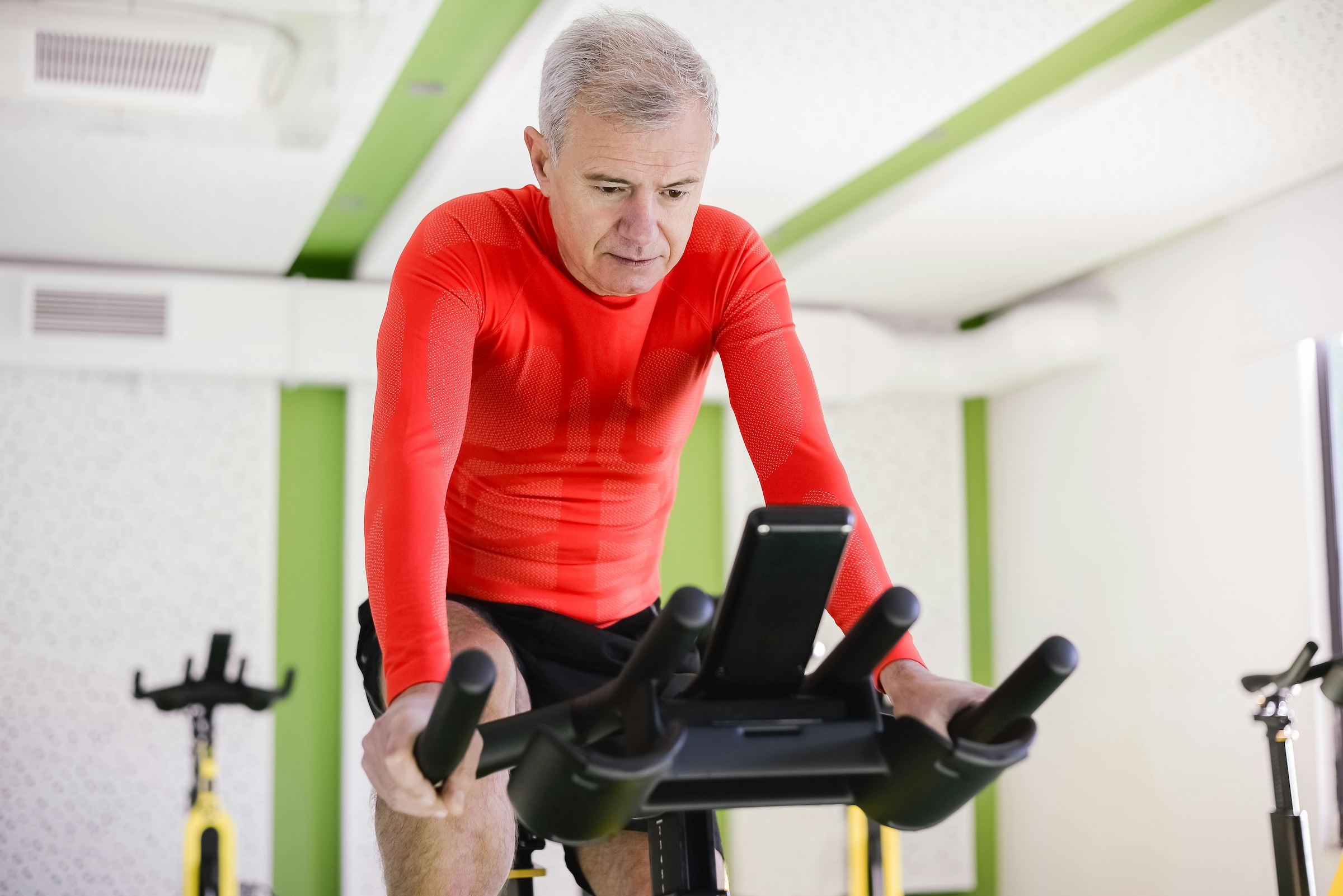 Man riding on an indoor bike.