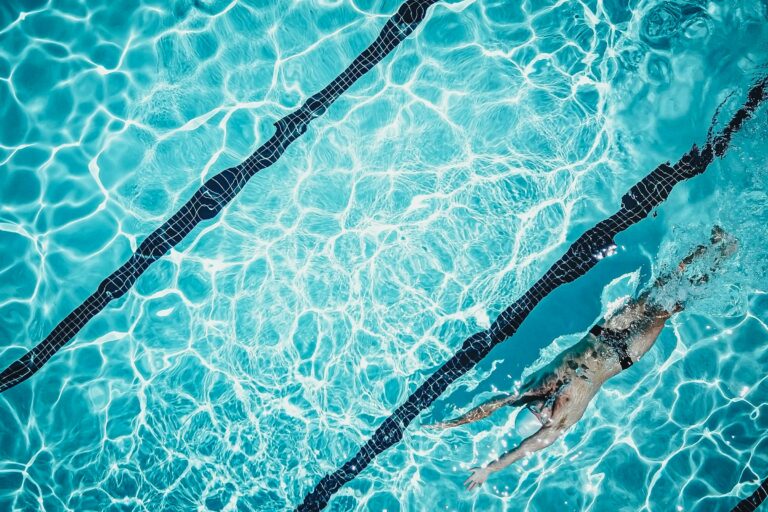 swimmer, face up, in a pool