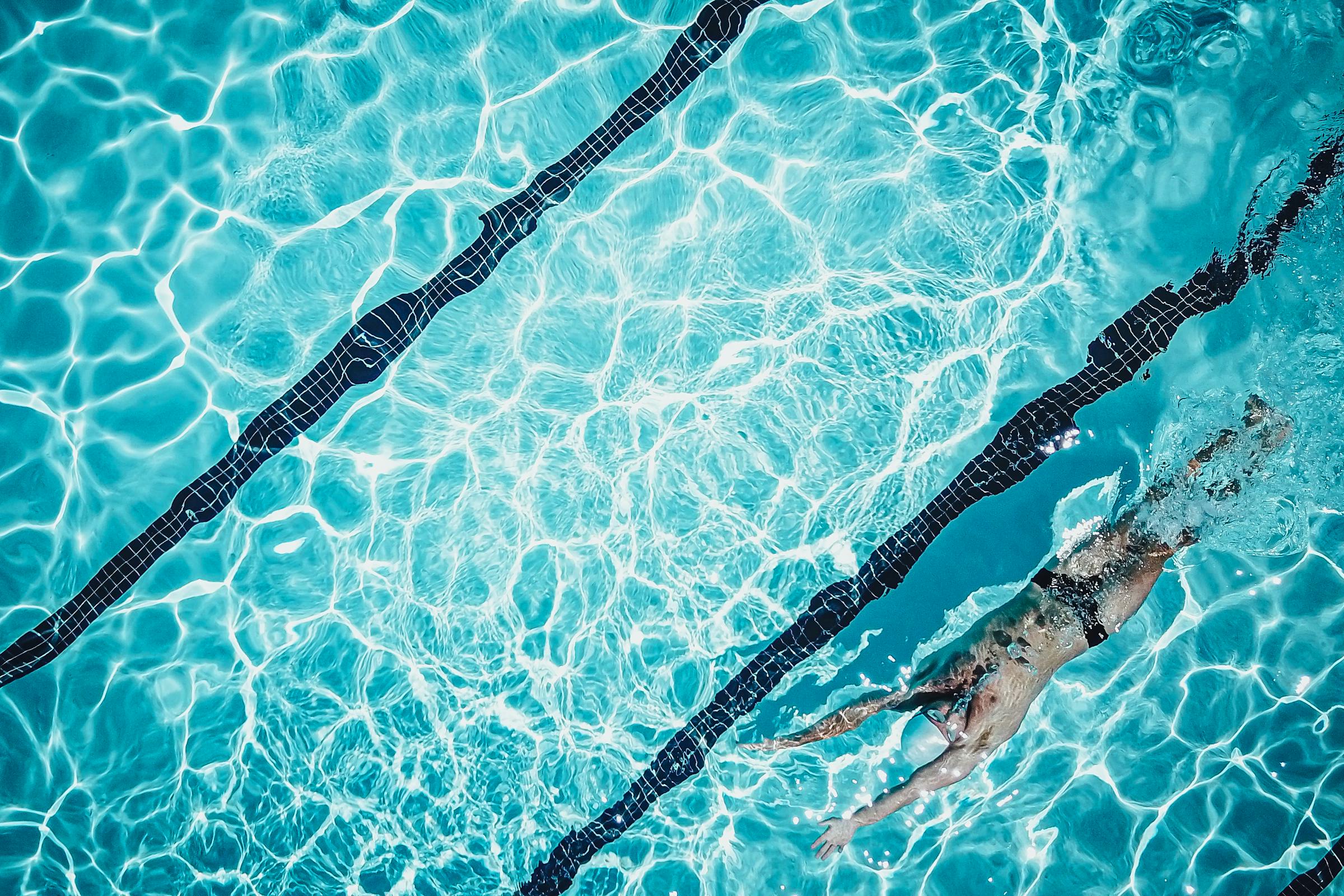 swimmer, face up, in a pool