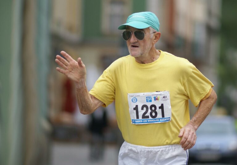 Older man running in a race