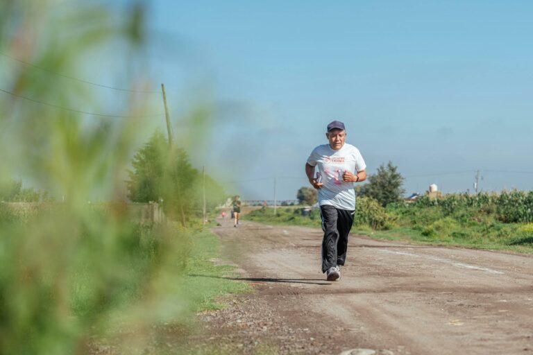 Older man running on dirt road