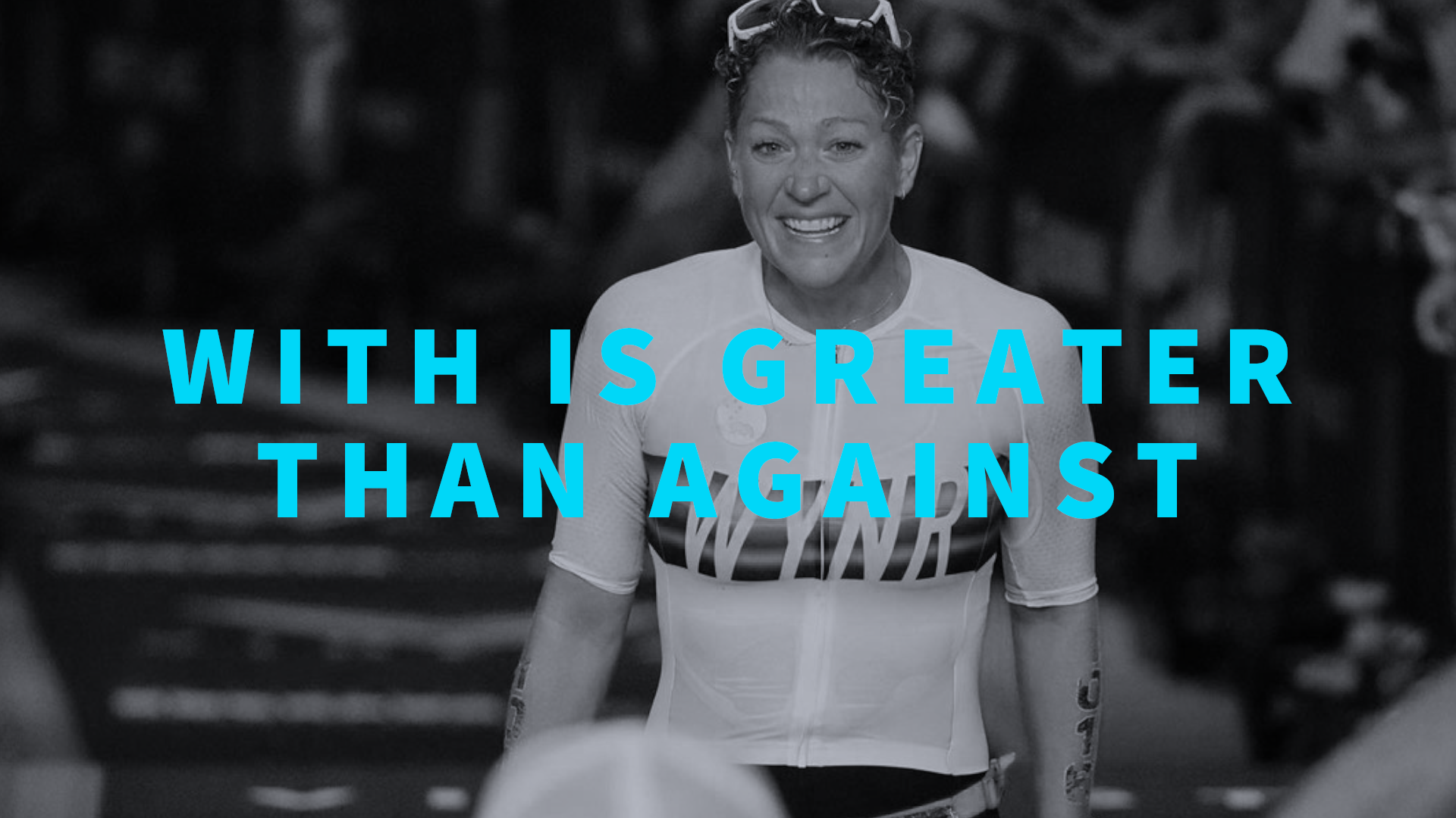 Lauren Vallee smiling while crossing a finish line