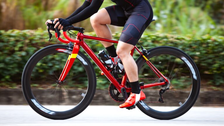 Lower section of a road cyclist riding their bike