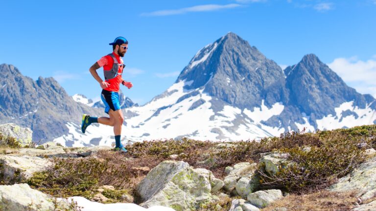 Man ultrarunning high in the mountains