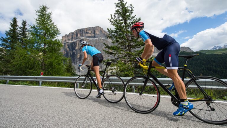 Two cyclists performing hill sprints around the Dolomites.