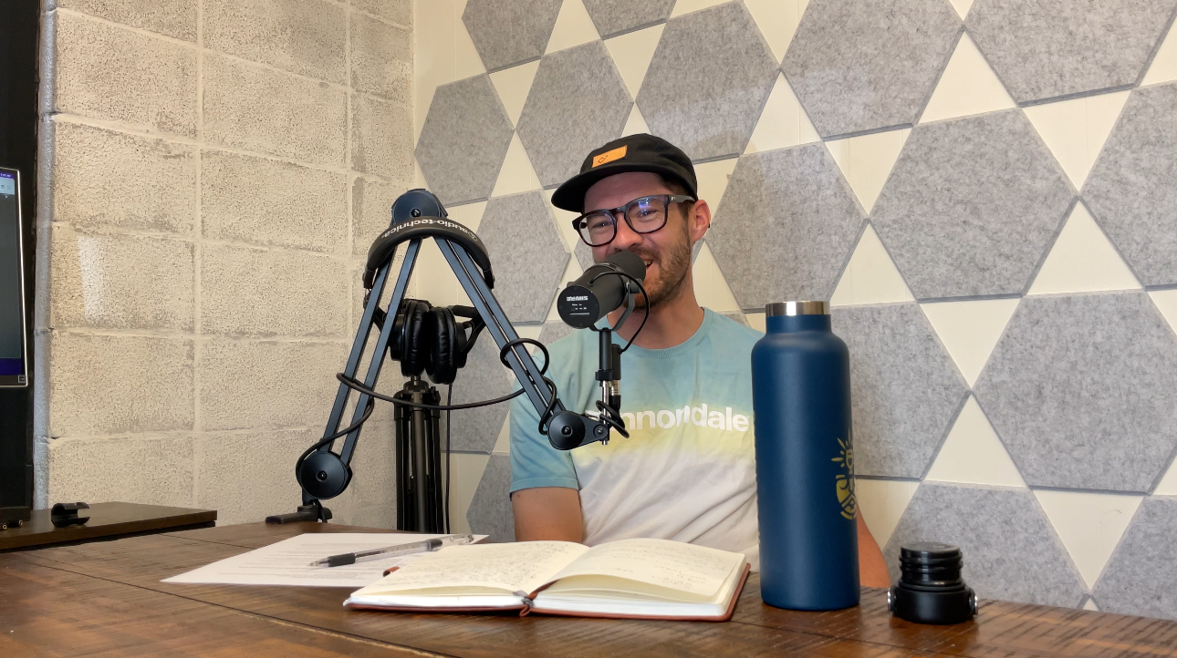 Alex Howes talking into a microphone